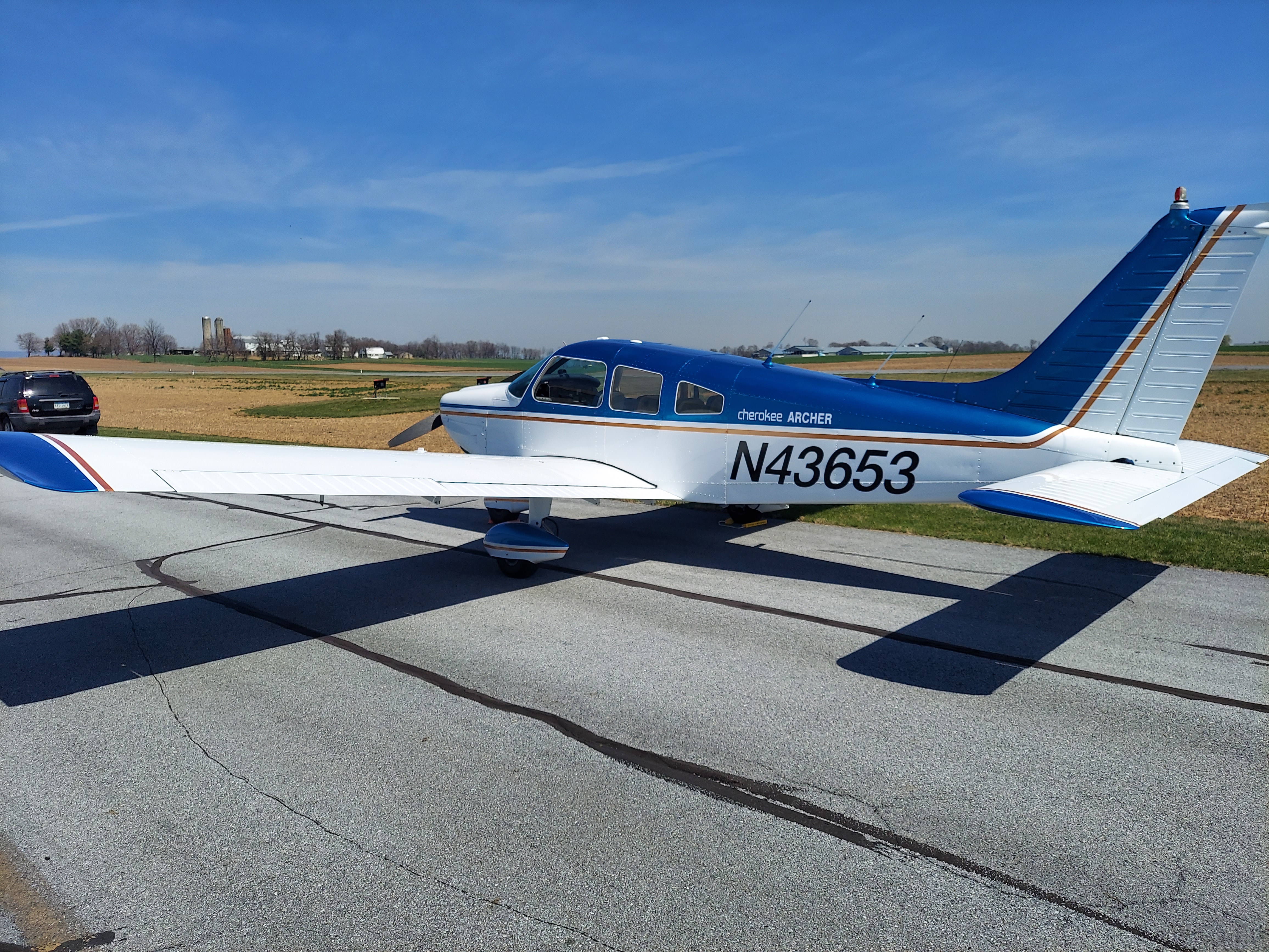 Blue and white Piper Archer after aircraft service
